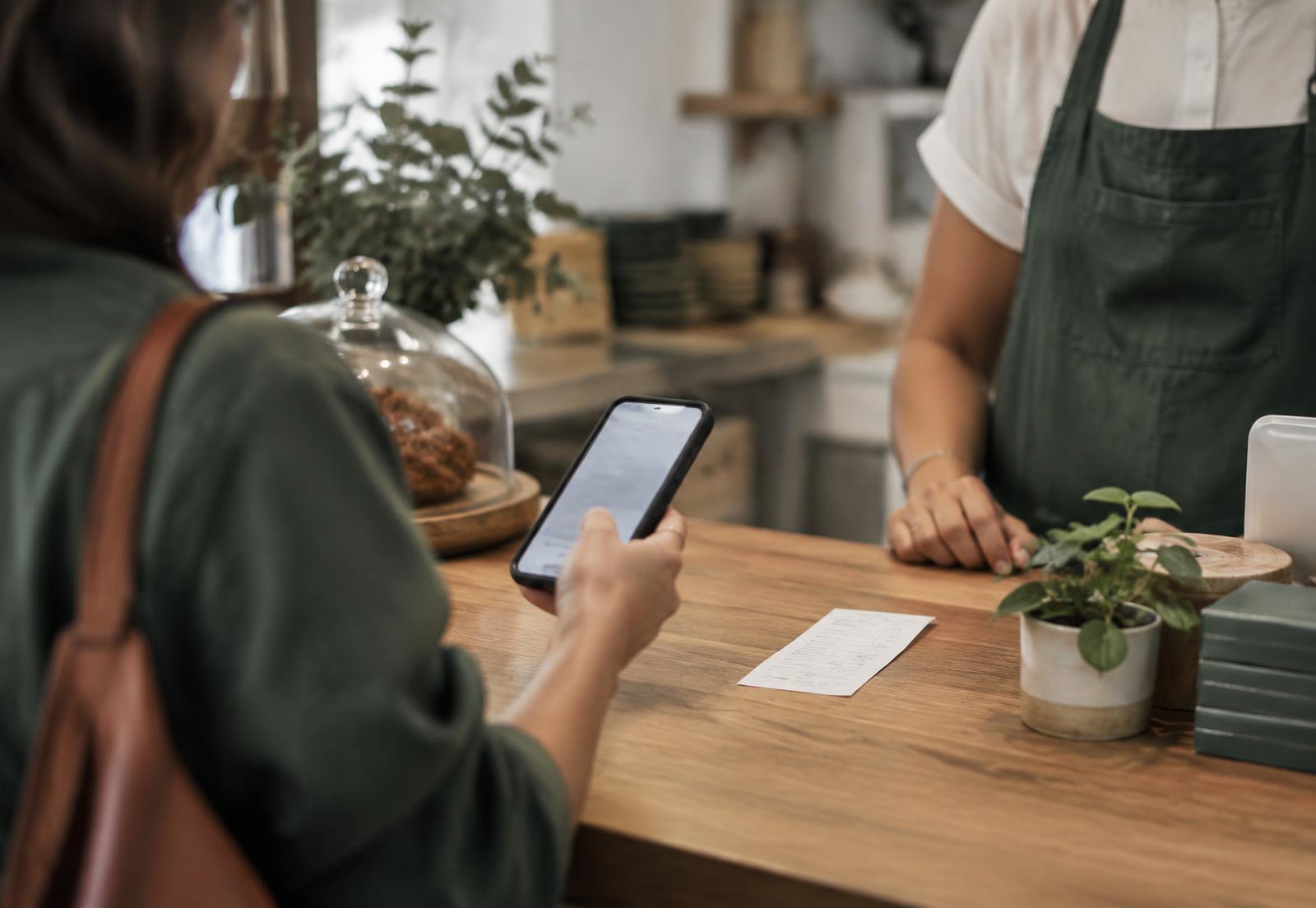 Business owner reviewing a professional customer feedback and reputation interface